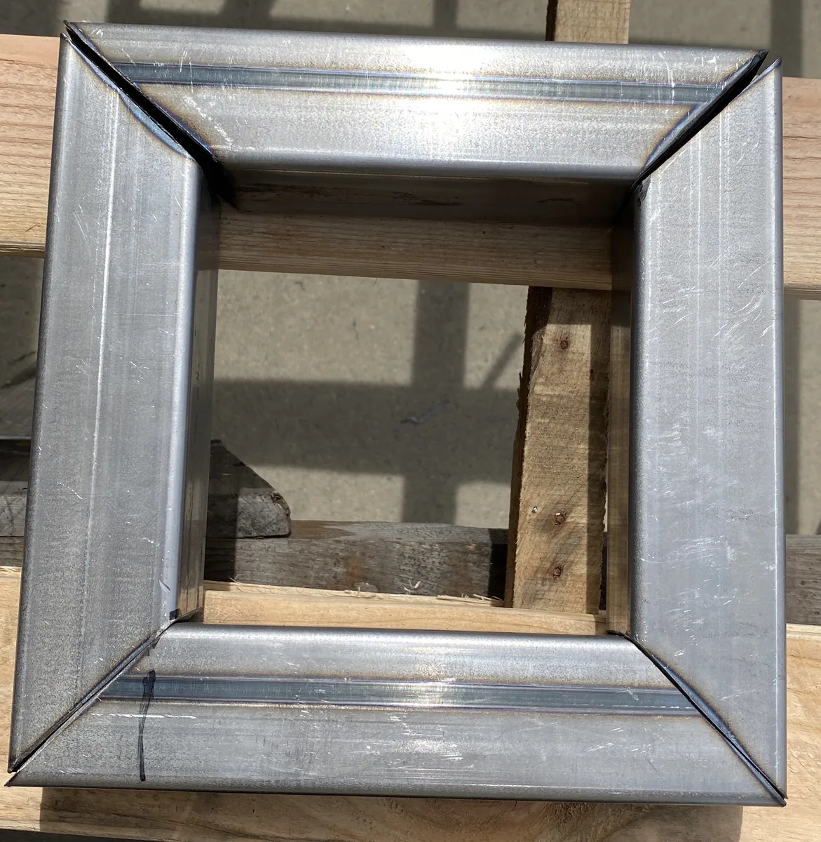 Gate frame showing gaps between the mitered joints